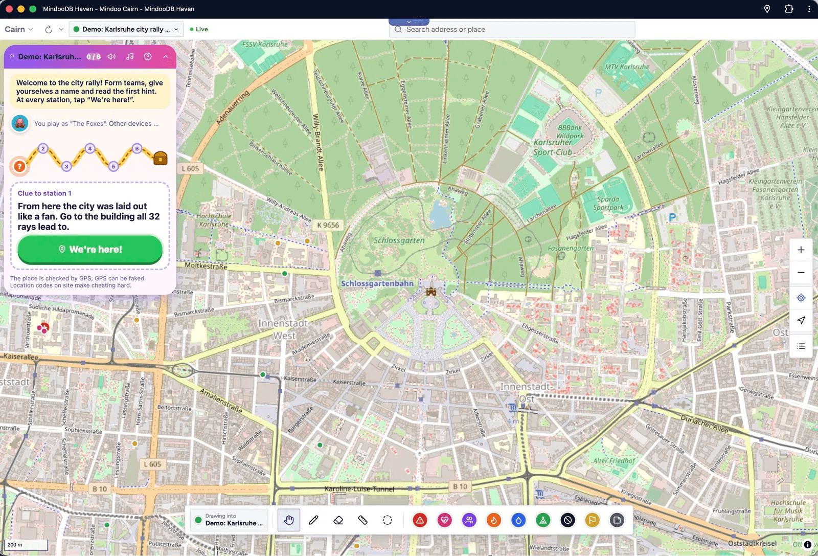 Mindoo Cairn game panel over the map of Karlsruhe with a welcome text, a trail of stations, the clue to station 1 and a green We're here button