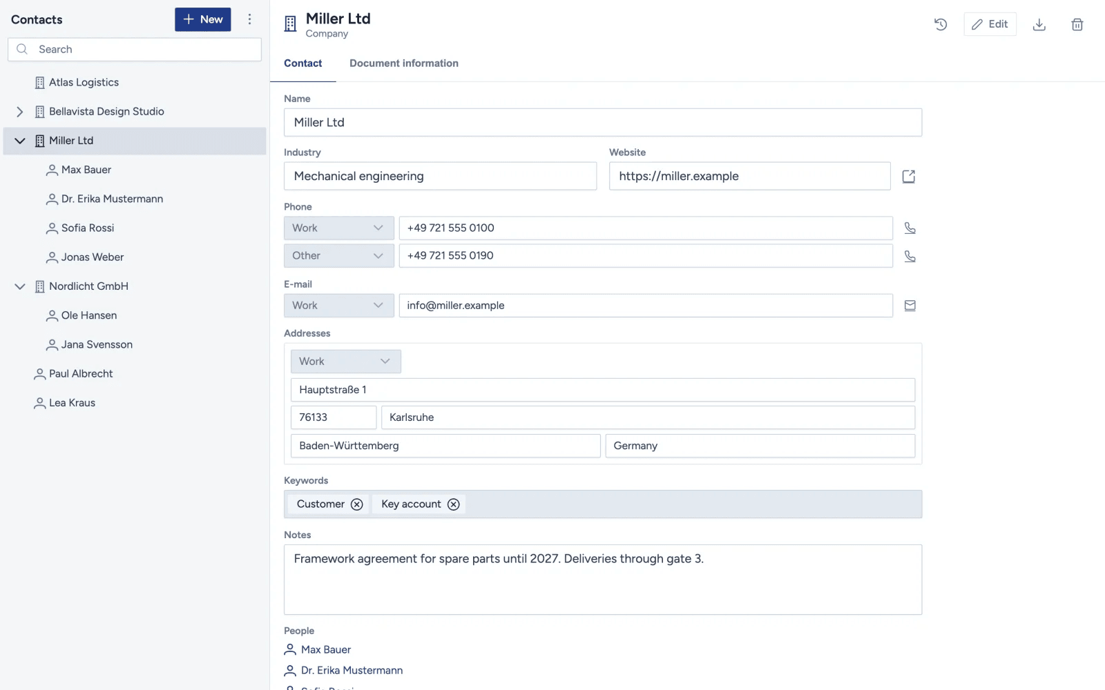 Mindoo Contacts with a tree of companies and their people on the left, Miller Ltd selected, and its form on the right with industry, website, phone numbers, e-mail, an address in Karlsruhe, the keywords Customer and Key account, a note and the list of its people