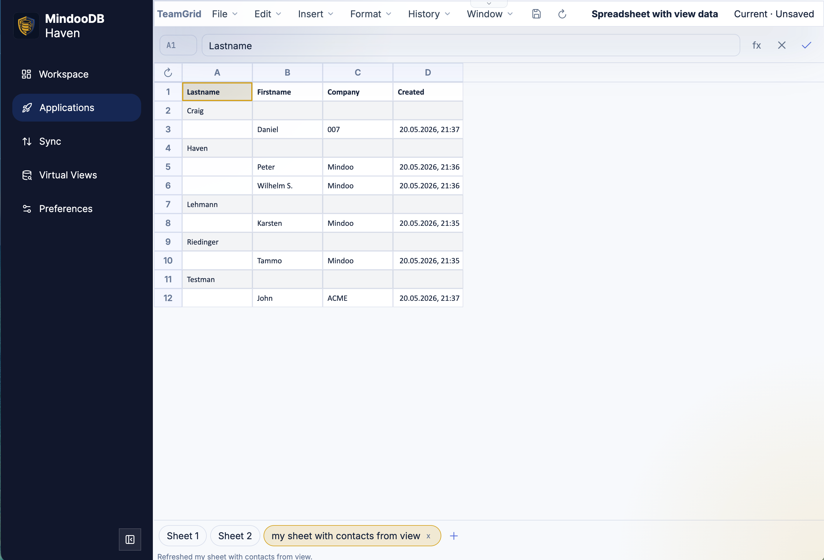 The resulting Virtual View Sheet in TeamGrid, titled "my sheet with contacts from view". The columns are Lastname, Firstname, Company, and Created. Category rows (Craig, Haven, Lehmann, Riedinger, Testman) sit on the same column as their grouped contact rows; each document row carries a first name, a company (Mindoo, ACME, 007), and a creation timestamp. A small Refresh button is visible in the top-left corner above the row numbers, and the status bar at the bottom reads "Refreshed my sheet with contacts from view"
